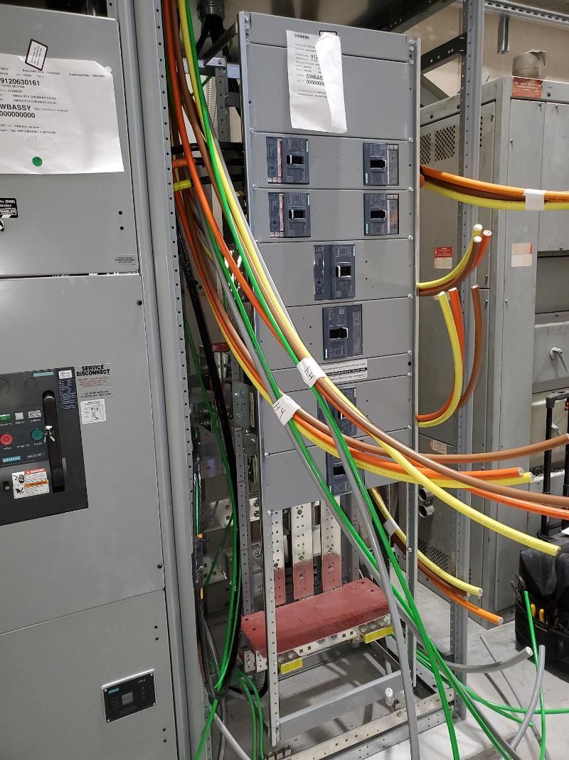 A bunch of wires are connected to a electrical box.