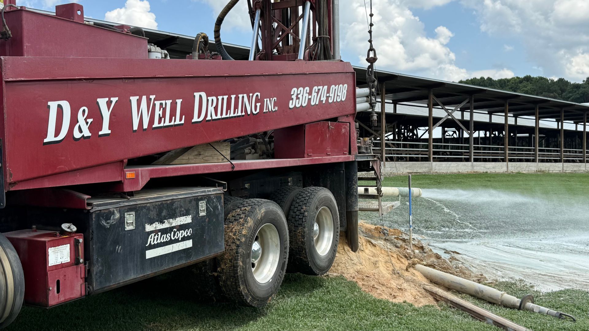A red truck with the words d & y well drilling on it