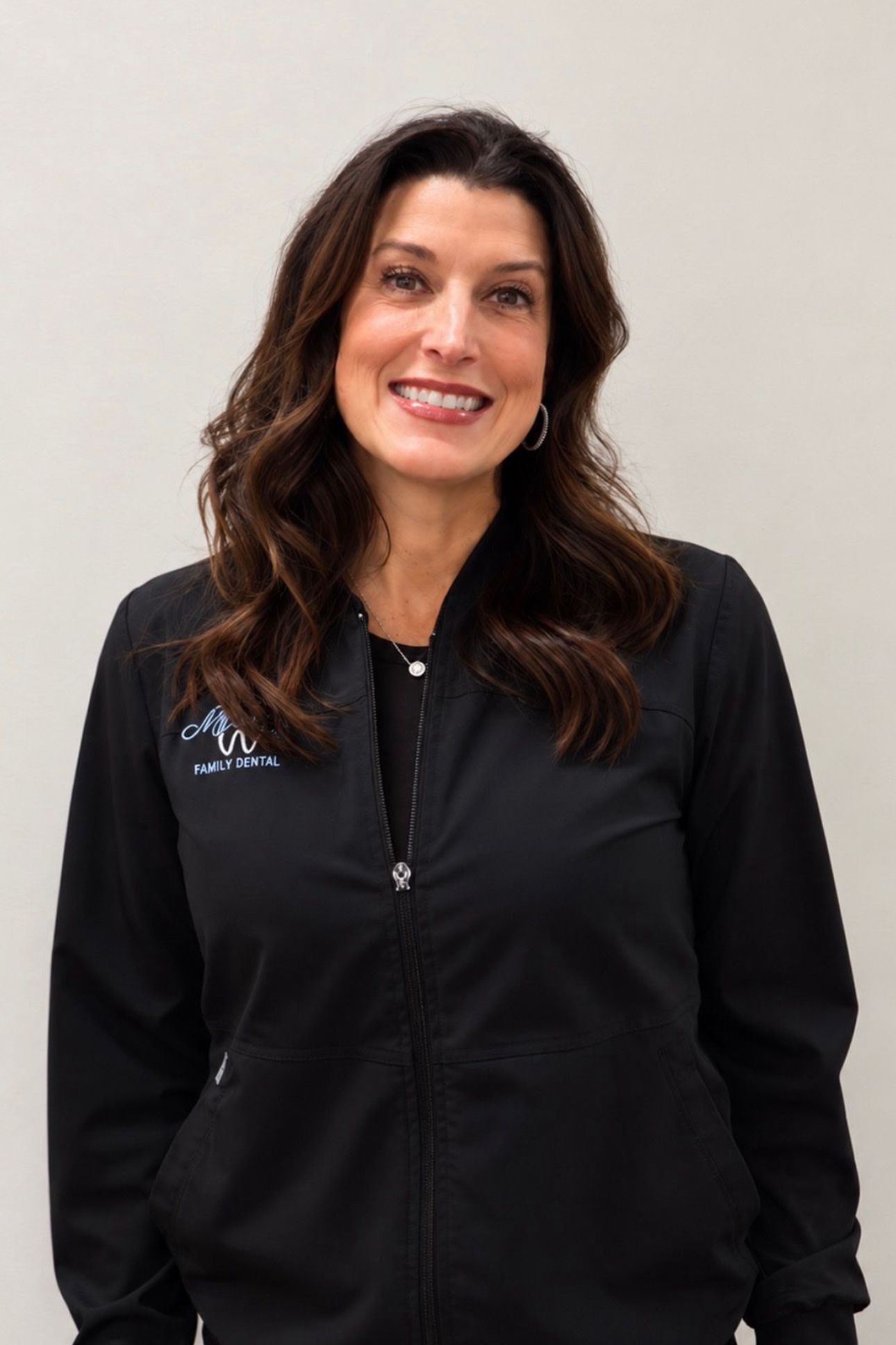 Woman in black jacket smiling
