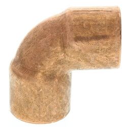 A close up of a copper elbow on a white background.