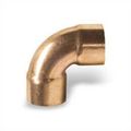 A close up of a copper elbow on a white background.