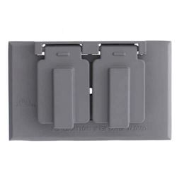 A close up of a gray electrical outlet cover on a white background.