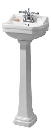 White pedestal sink with chrome faucet.