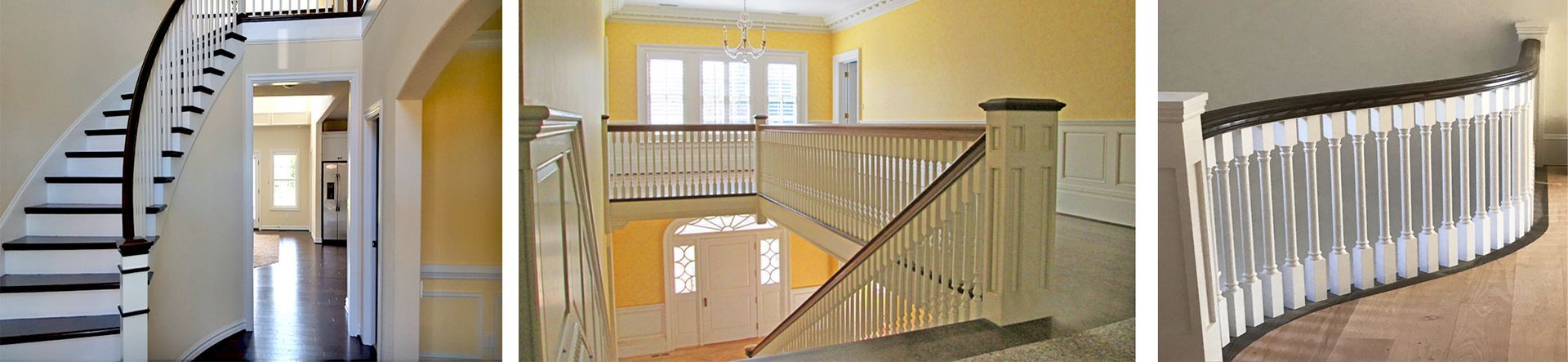 A staircase with white railings and black handrails. It appears to be an entryway or hallway of a home.