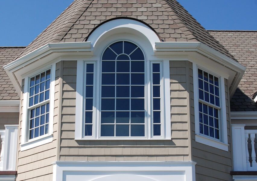 A house with a large window on the side of it