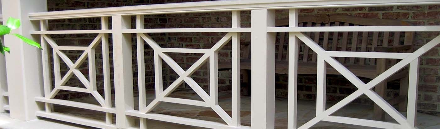 A close up of a white railing on a balcony.