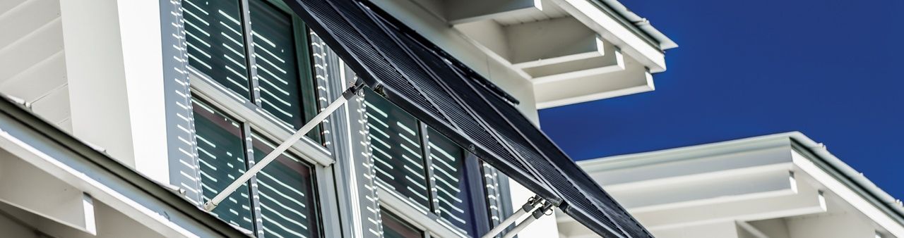 A close up of a building with a blue sky in the background.