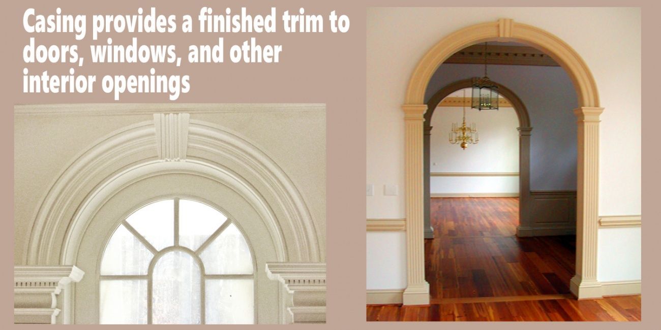 Two interior archways with decorative trim. One frames a window with a circular top, the other frames an opening to a room.