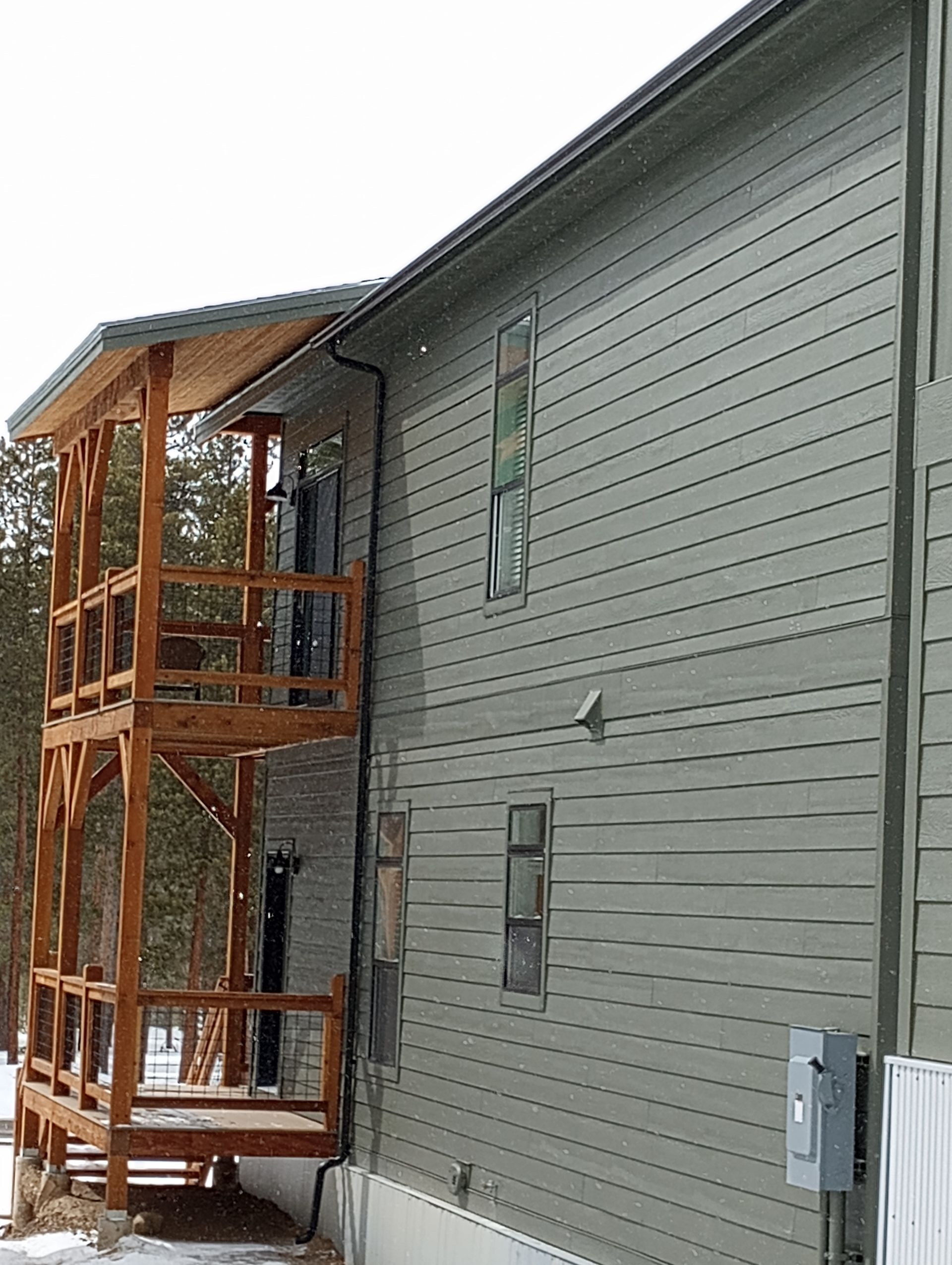 Beautiful seamless gutter of a gray house
