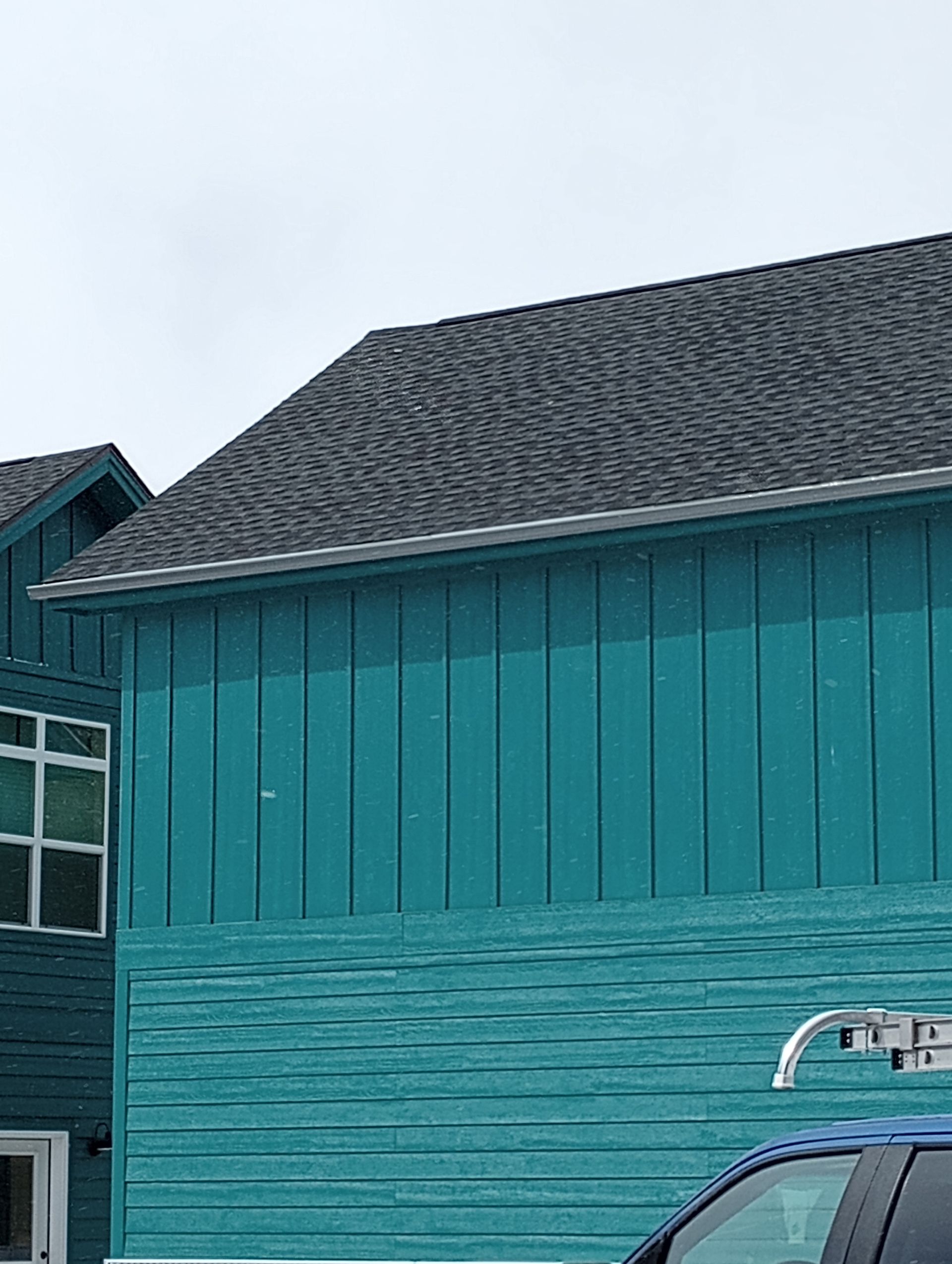 Beautiful seamless gutter of a bluish green property