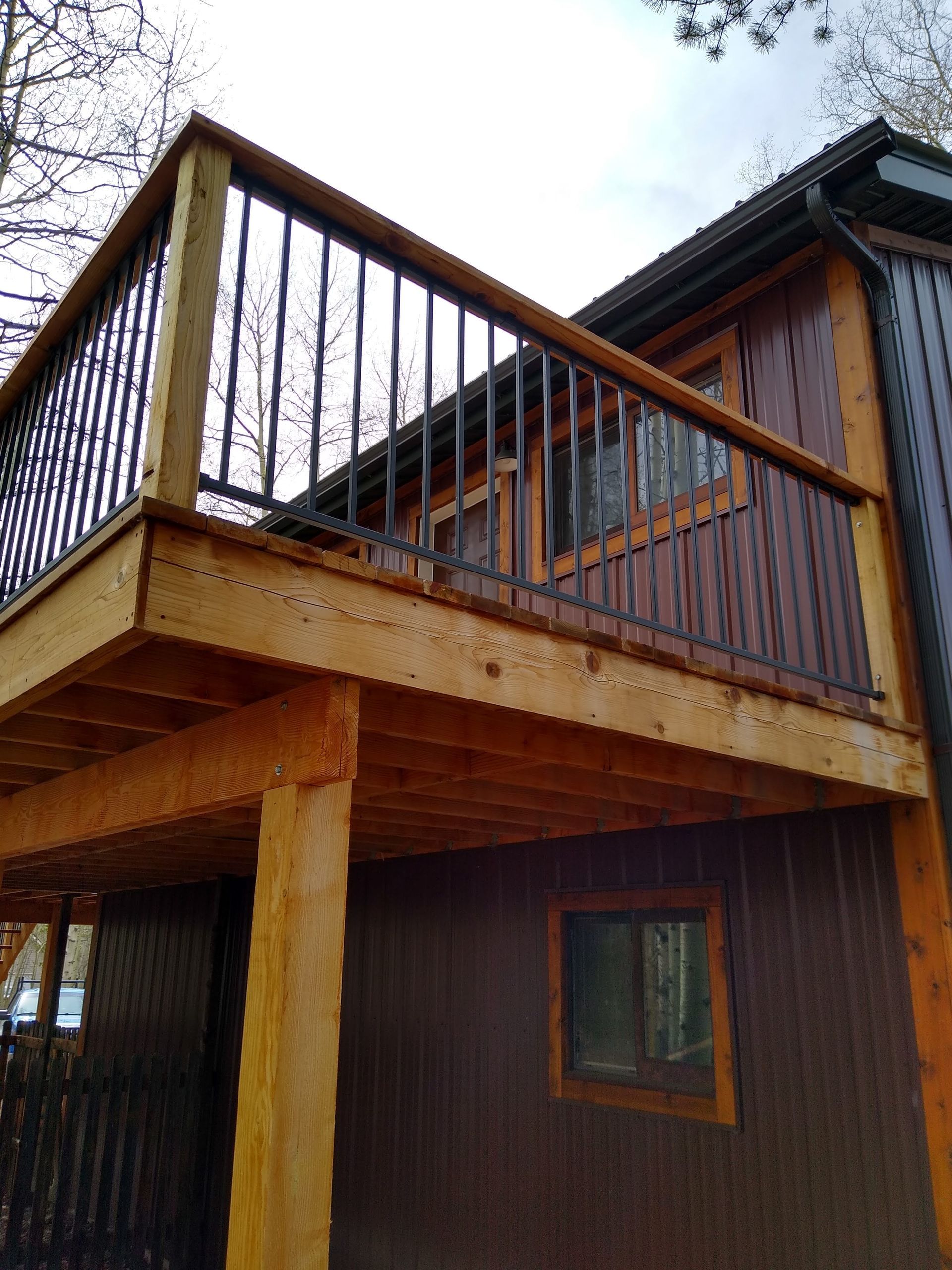 Beautiful deck showing black seamless gutter