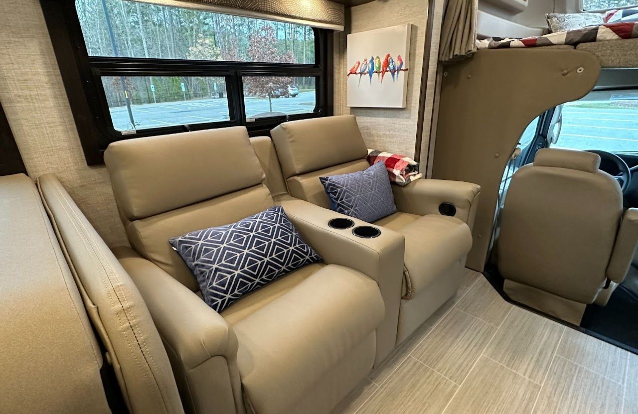 There are two chairs in the back of a rv.