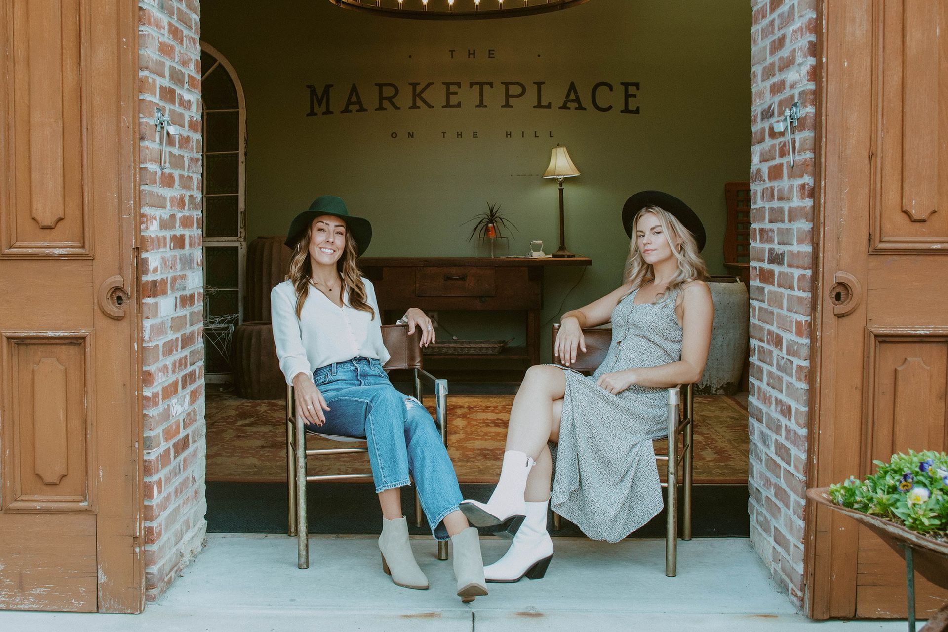 Two women sit in front of 