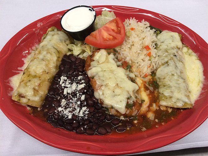 Mexican food with beans on red plate