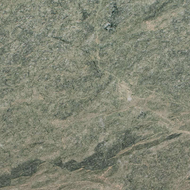 Green and gray stone surface, textured with lines and variations in color and tone.