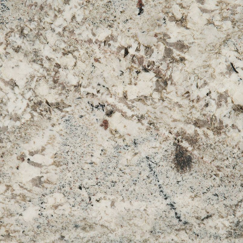 Close-up of a white granite countertop with various gray and brown mineral inclusions.