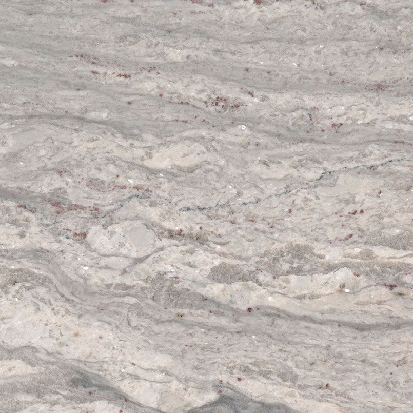 Swirling white and gray granite countertop with flecks of brown.