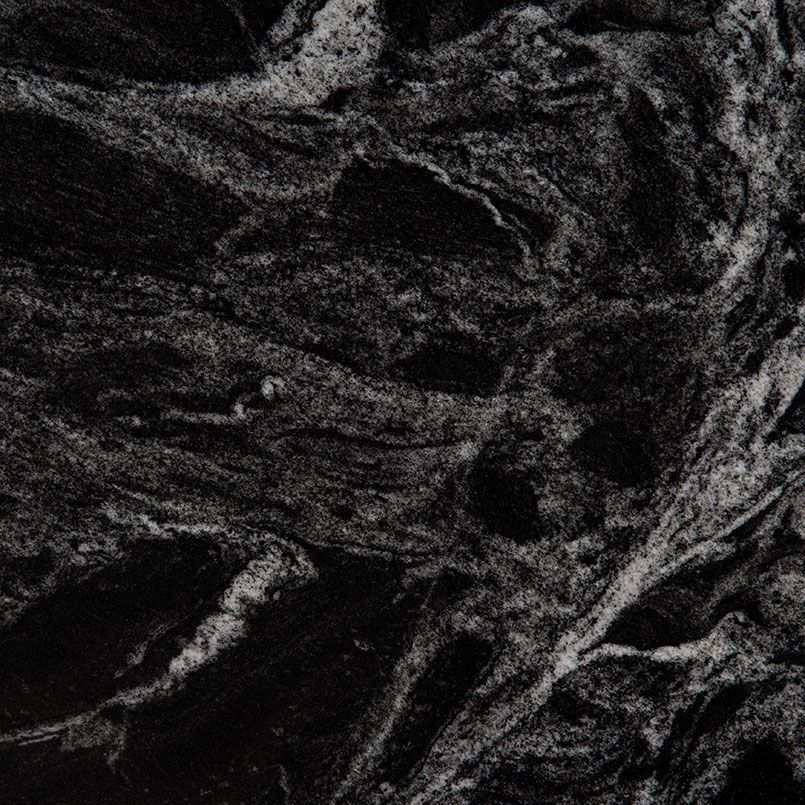 Black granite with swirling white and gray veins.