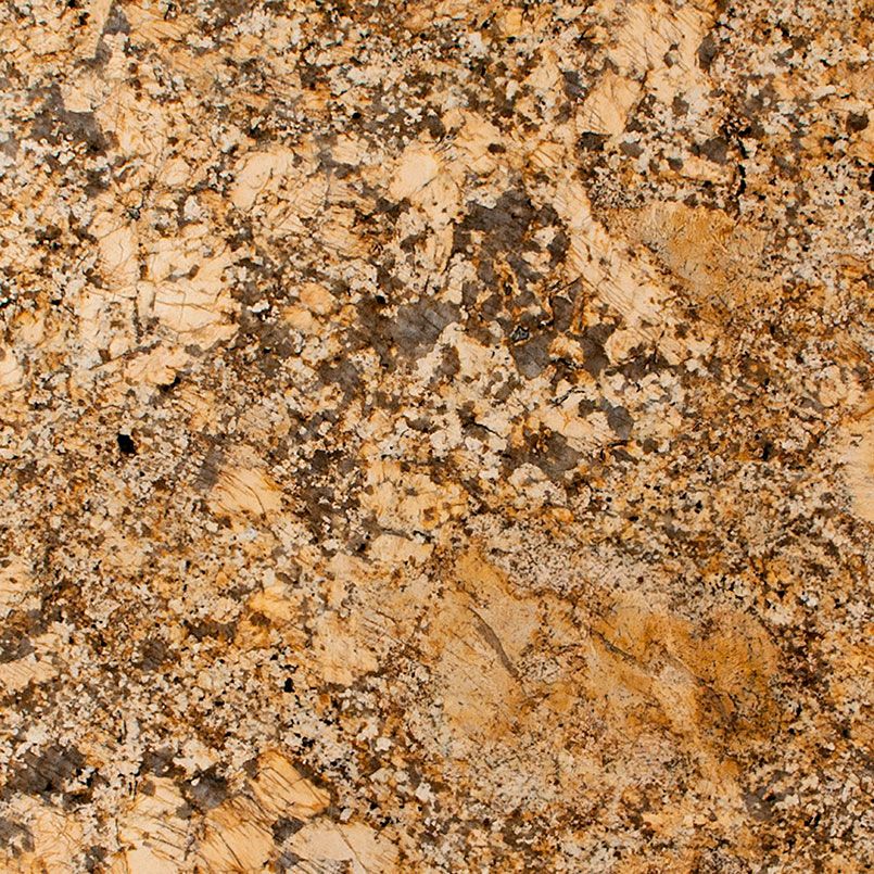 Close-up of granite countertop with a golden-brown and gray speckled pattern.