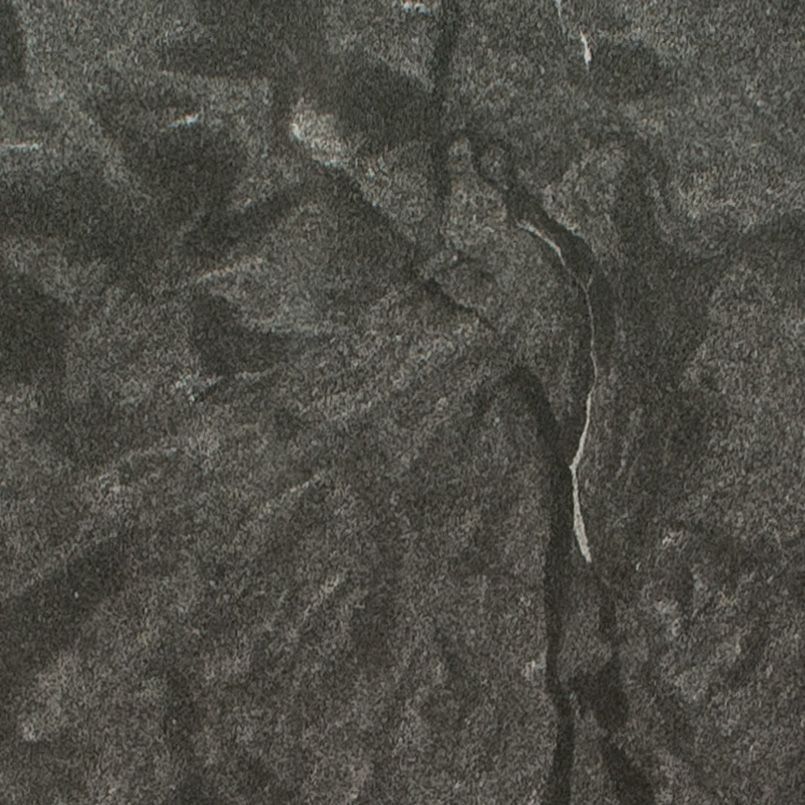 Dark gray stone surface with cracks and texture.