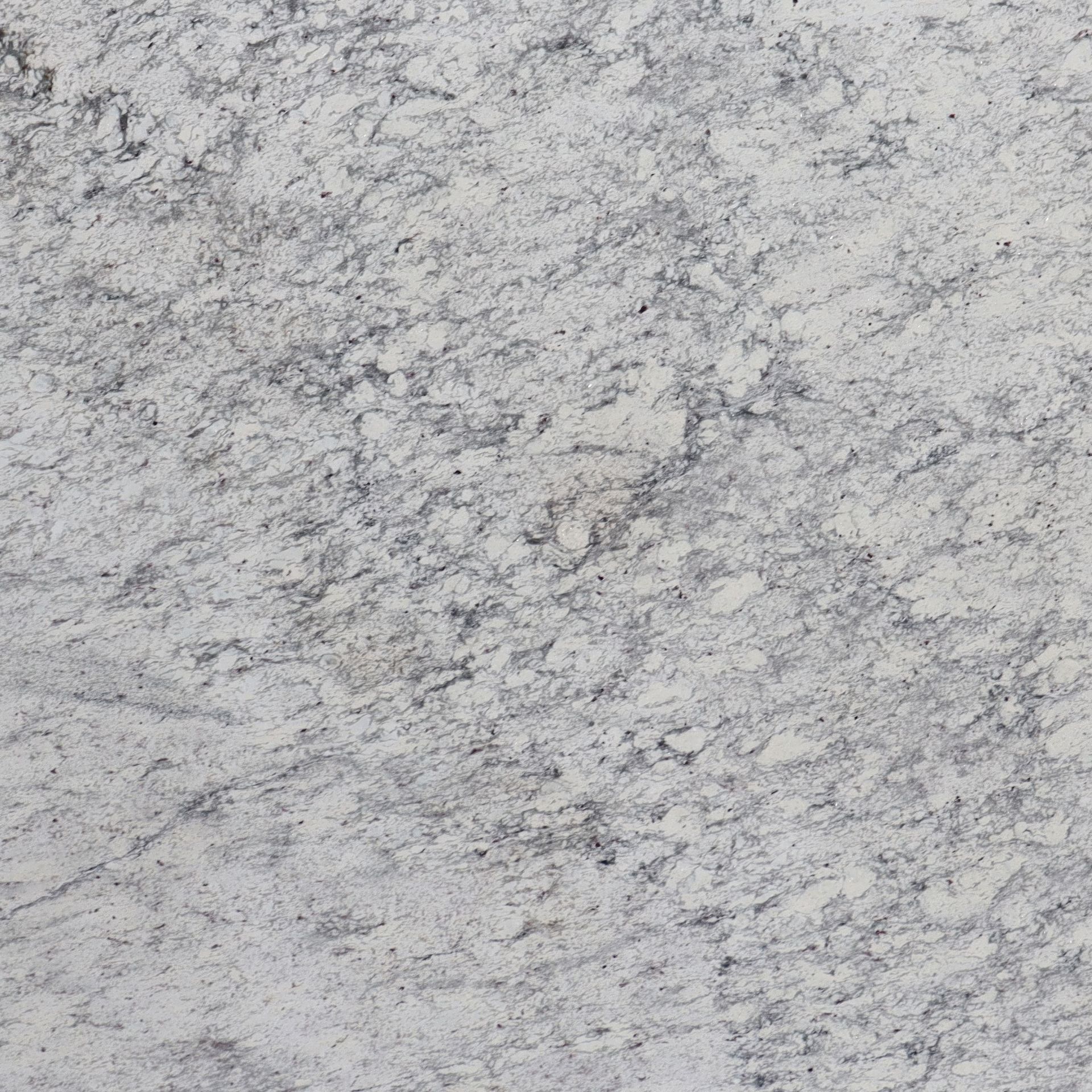 White granite countertop with gray and black speckling.