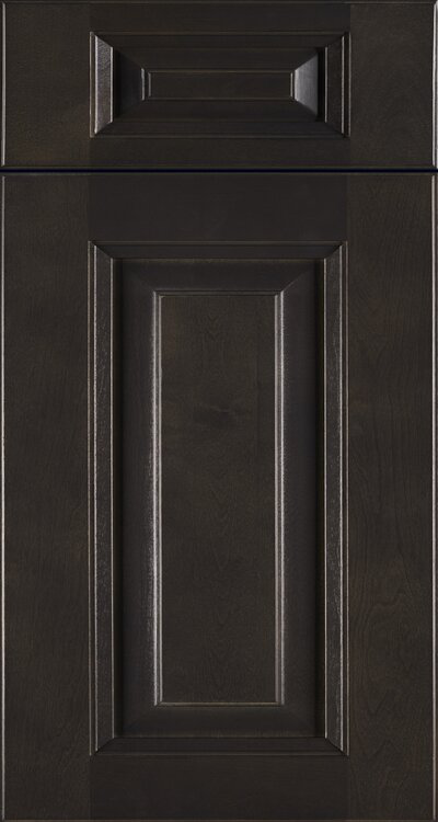 Dark brown cabinet door with raised panel and top detail.