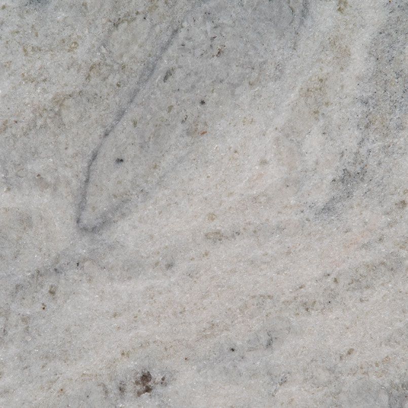 White and gray marble slab with subtle veining and flecks.