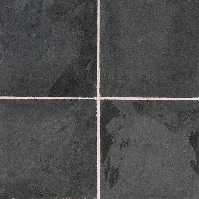 Four dark gray square tiles with white grout lines.