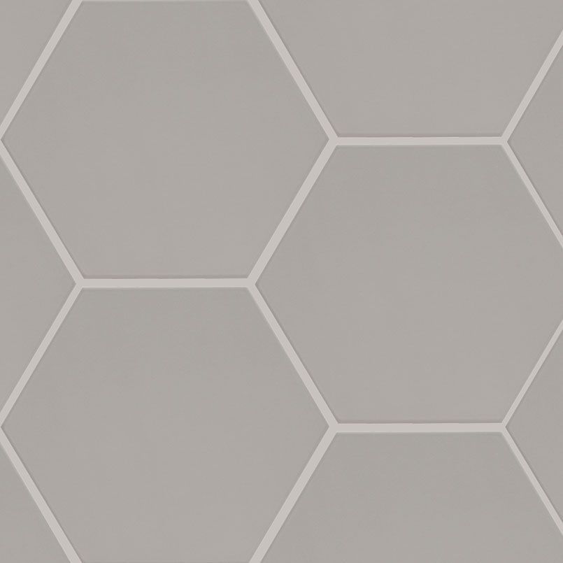 Gray hexagonal tiles with white grout, creating a geometric pattern.