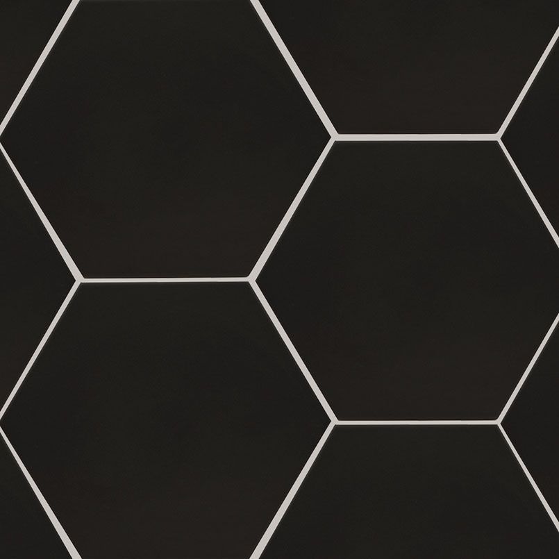 Black hexagonal tiles with white grout.