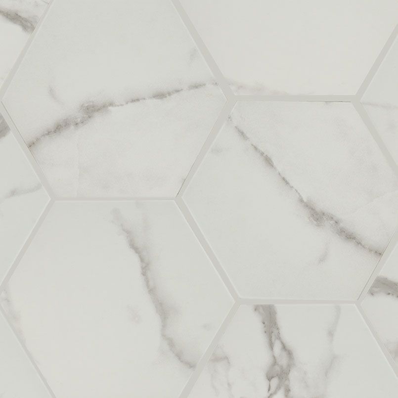 White hexagon marble tiles with gray veining.
