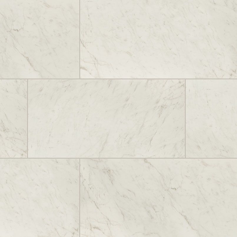 White rectangular marble-look tiles with subtle veining arranged in a stacked pattern.