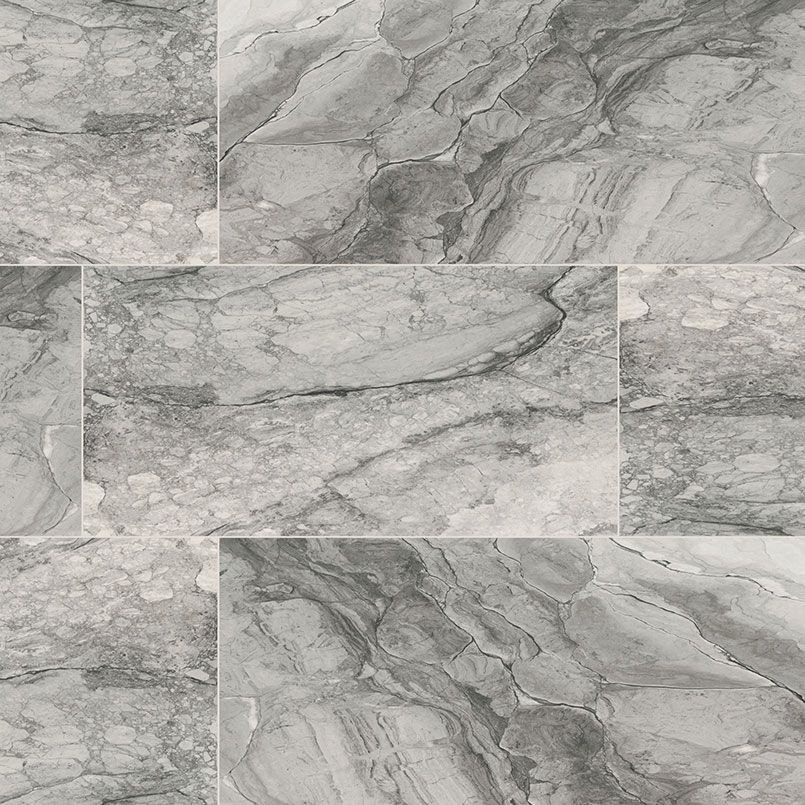 Gray marble-look ceramic tiles arranged in a brick pattern with swirling patterns and dark veins.