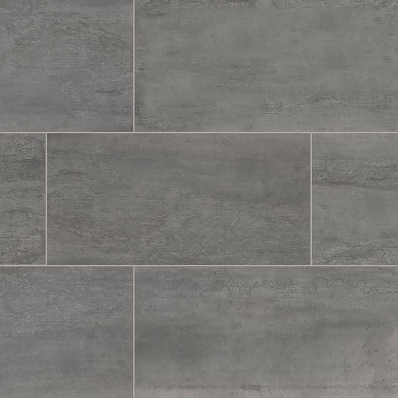 Gray rectangular tiles arranged in a grid pattern with thin grout lines.