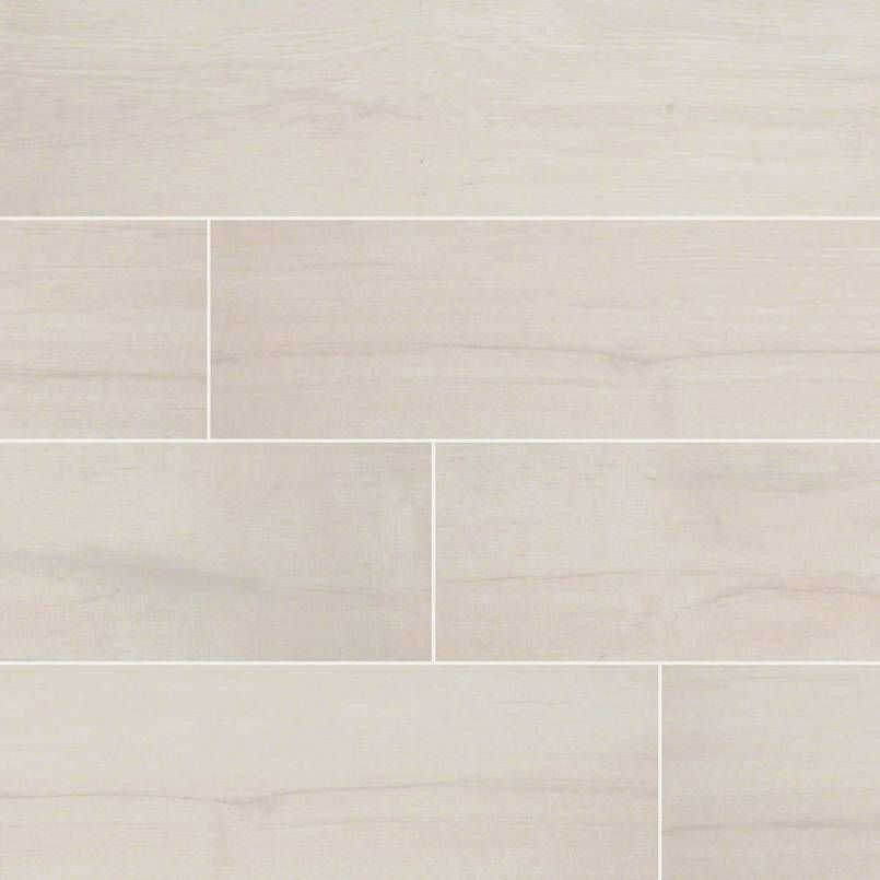 Light beige, wood-look floor tiles arranged in a staggered pattern with thin white grout lines.
