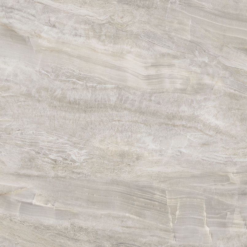 Light beige marble tile with swirled veining.
