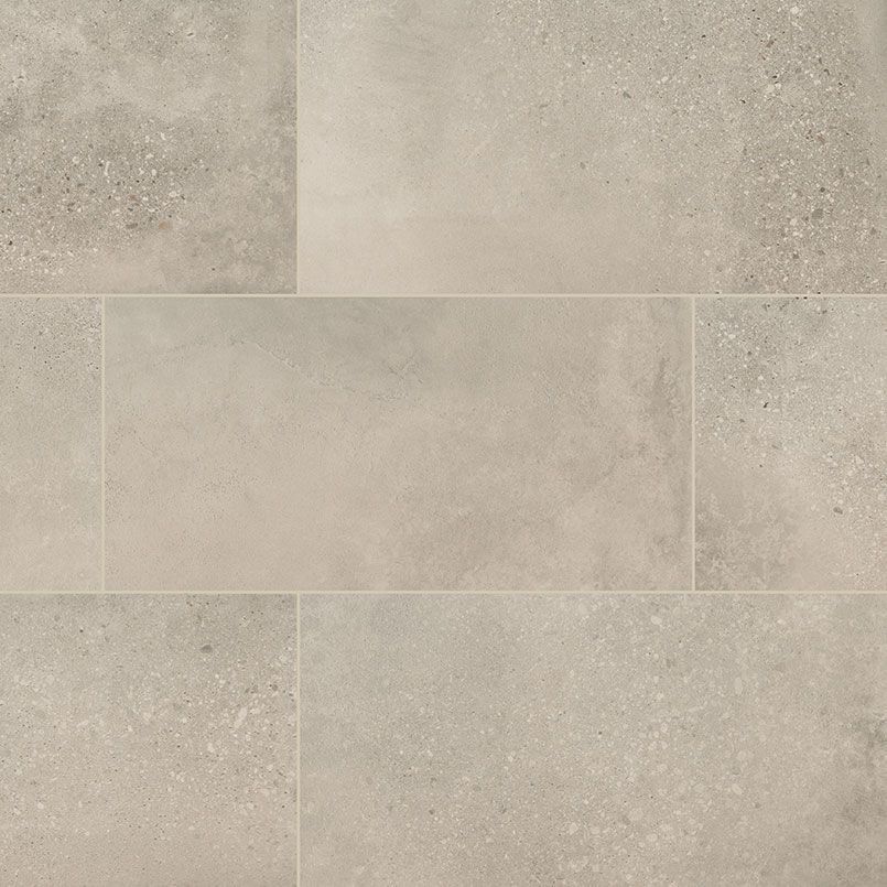 Light gray rectangular tiles with speckled texture.