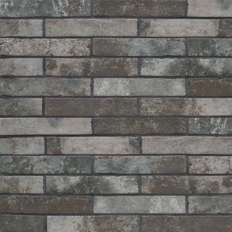 Textured brick wall in shades of gray and brown.