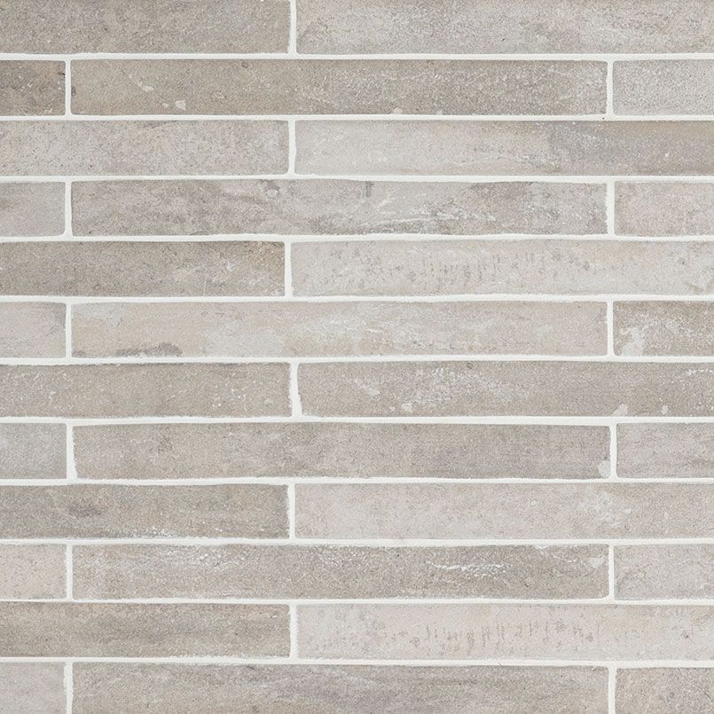 Gray and beige brick-like tile pattern with white grout lines.
