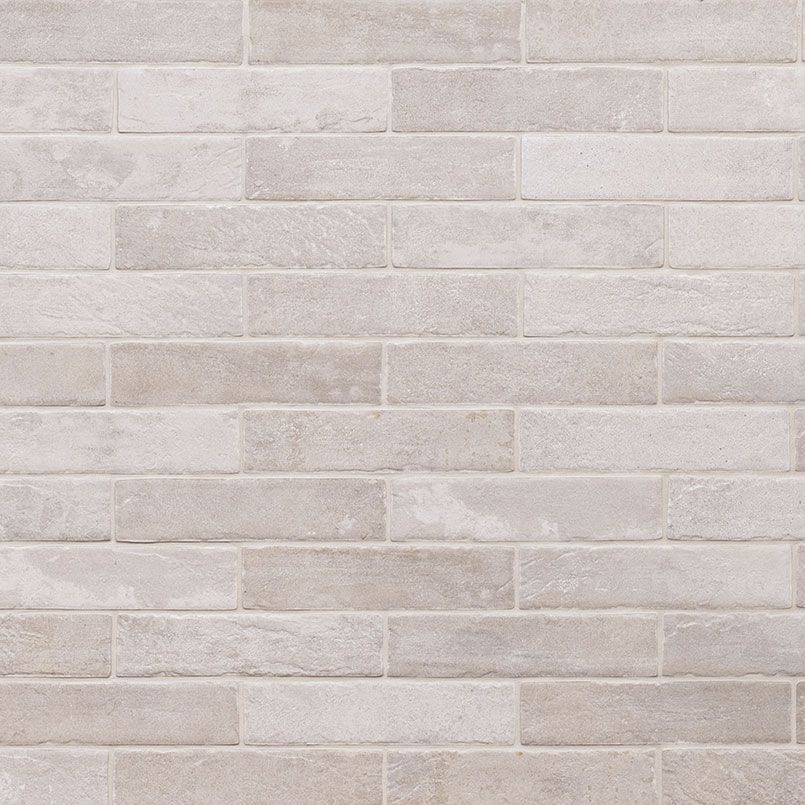Light gray brick wall texture.