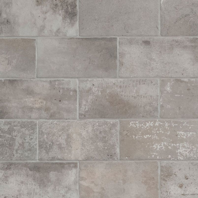 Gray rectangular stone wall tiles.