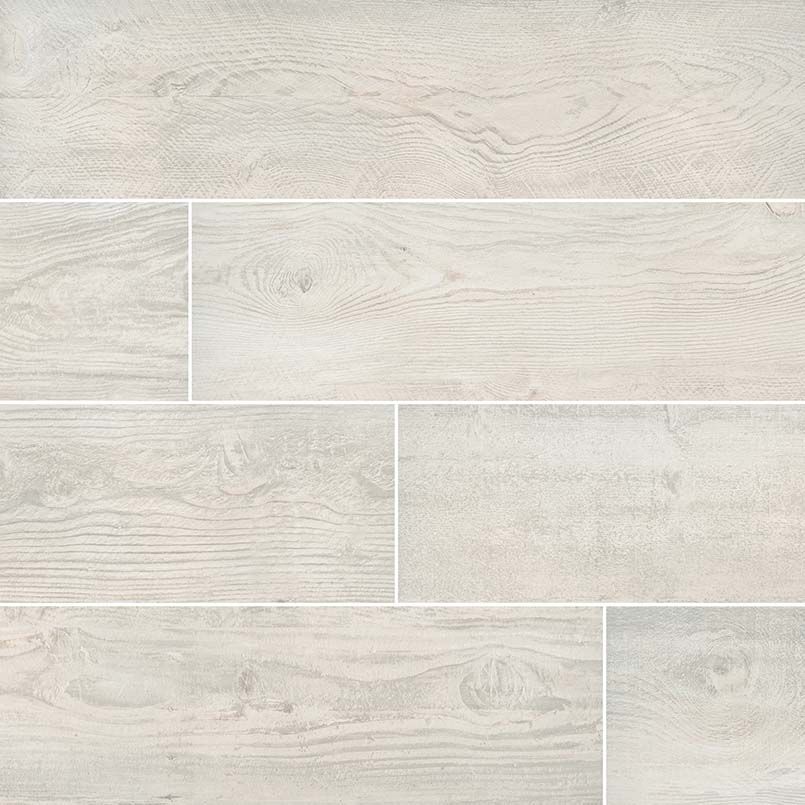 Light-colored wood-look ceramic tile flooring in a random pattern with variations in grain.