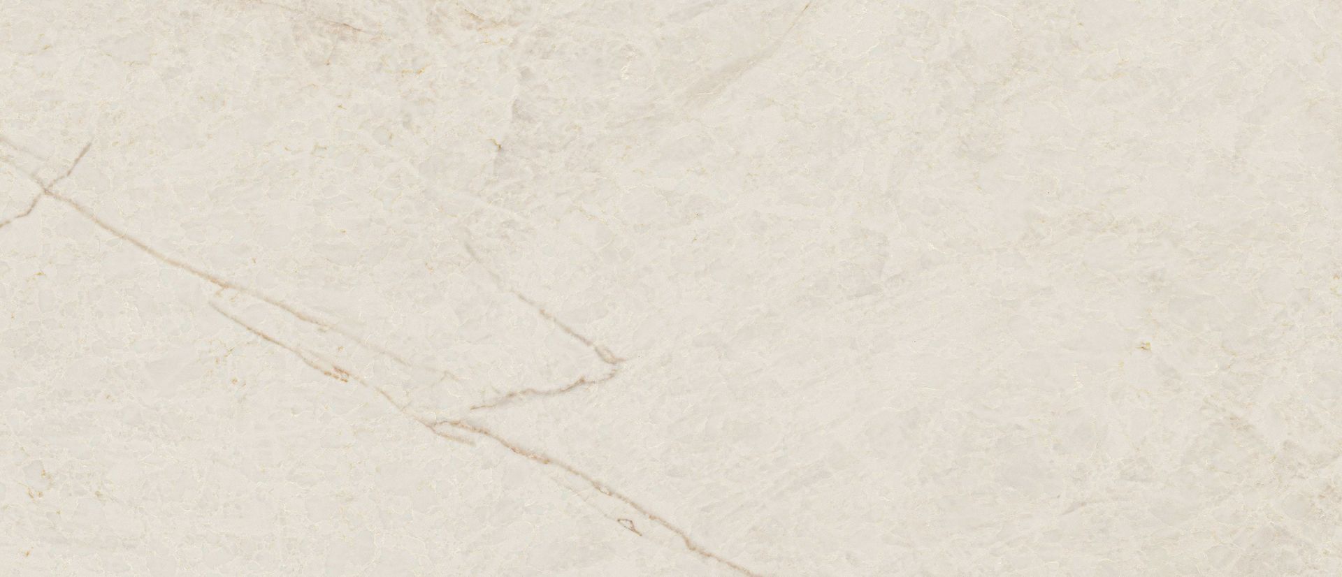 Cream-colored marble surface with subtle veining and texture.