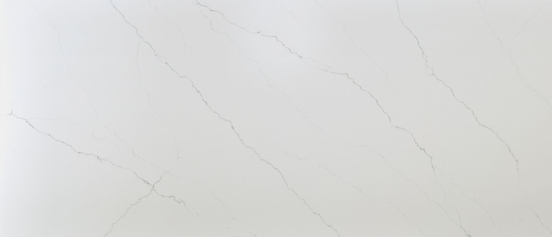 White countertop with subtle gray veining.