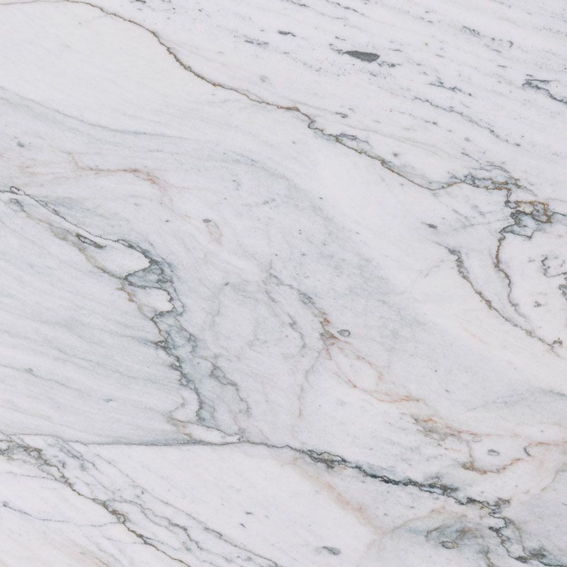 White marble with gray and gold veining.