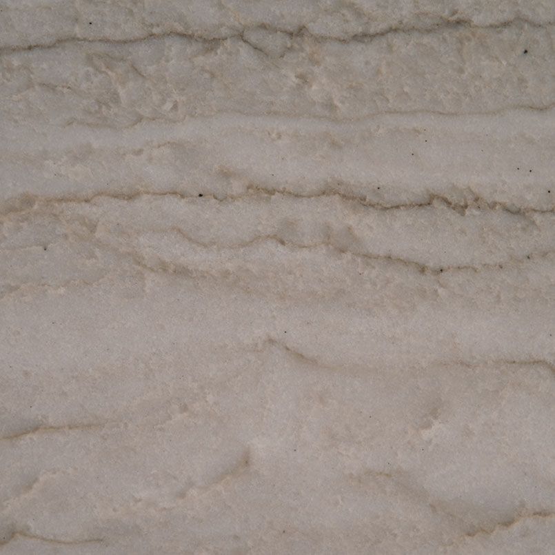 Cream and gray stone with horizontal, wavy striations.