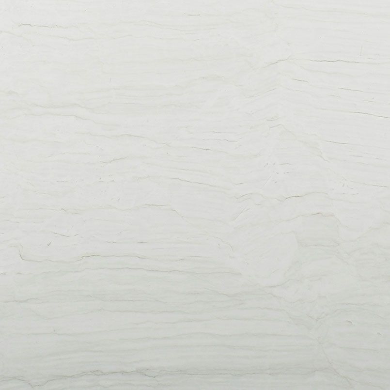 White stone surface with subtle horizontal veining.