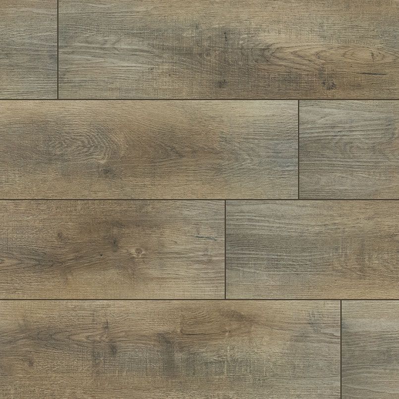 Close-up of weathered wood plank flooring with shades of brown and gray.