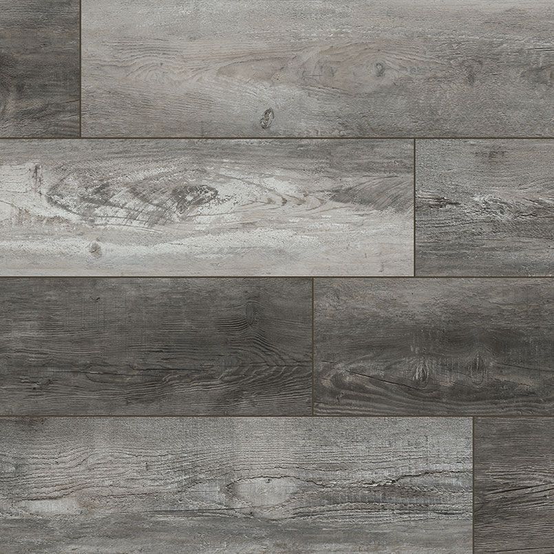 Gray wood-look flooring with varying shades and wood grain texture.
