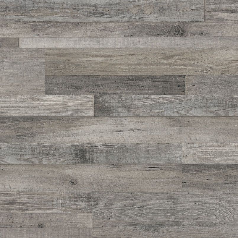 Gray wood plank flooring with varying tones and textures.